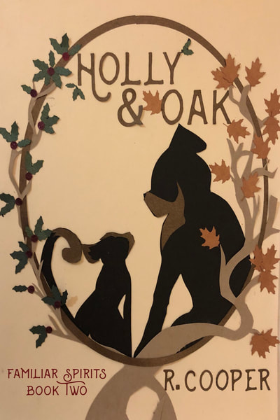 Cover for Holly and Oak. Two familiars--a cat and a dog--sit amid oak leaves and sprigs of holly. 